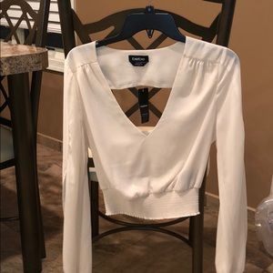 Crop top with cut out sleeves and open back.